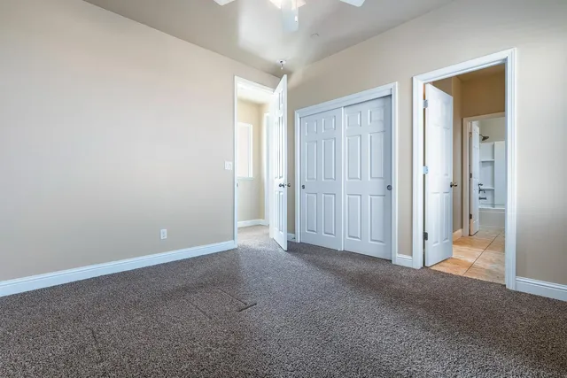 a view of a chair and tables in the patio