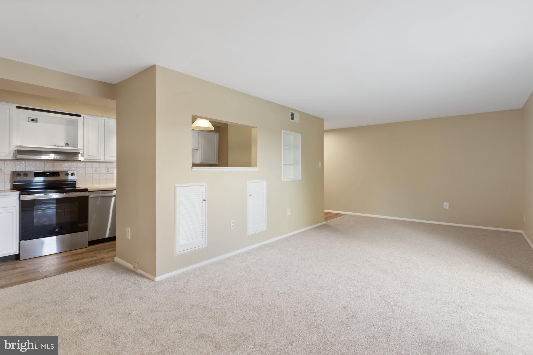 731 L Heather Ridge Drive Frederick, MD 21702 - Photo 9 of 26 Large living room with pass to kitchen.