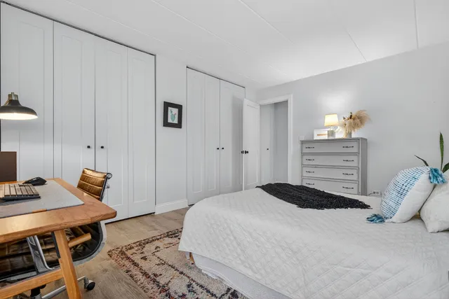 a bedroom with a bed and a table in it