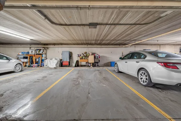 a view of parking garage with cars