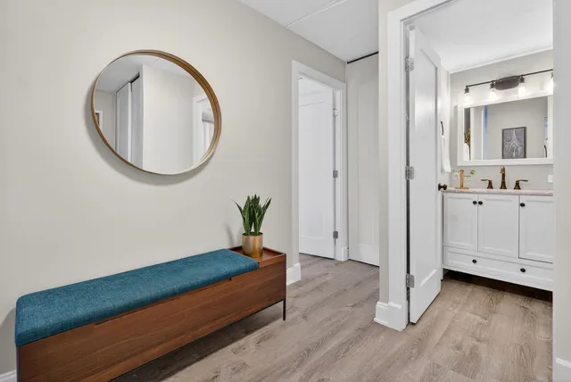 wooden floor with white cabinet