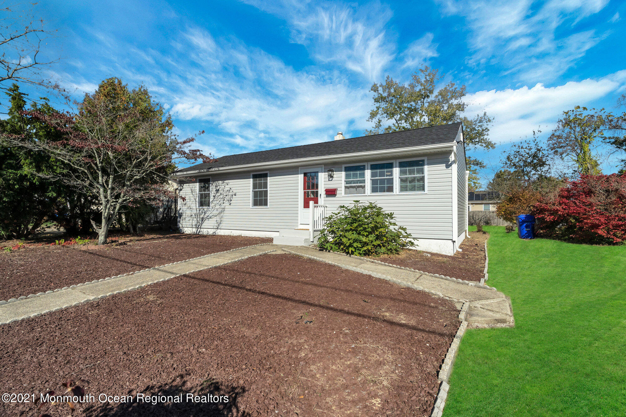 318 Bellanca Road Brick, NJ 08723 - Photo 2 of 23 a front view of a house with a yard and garage