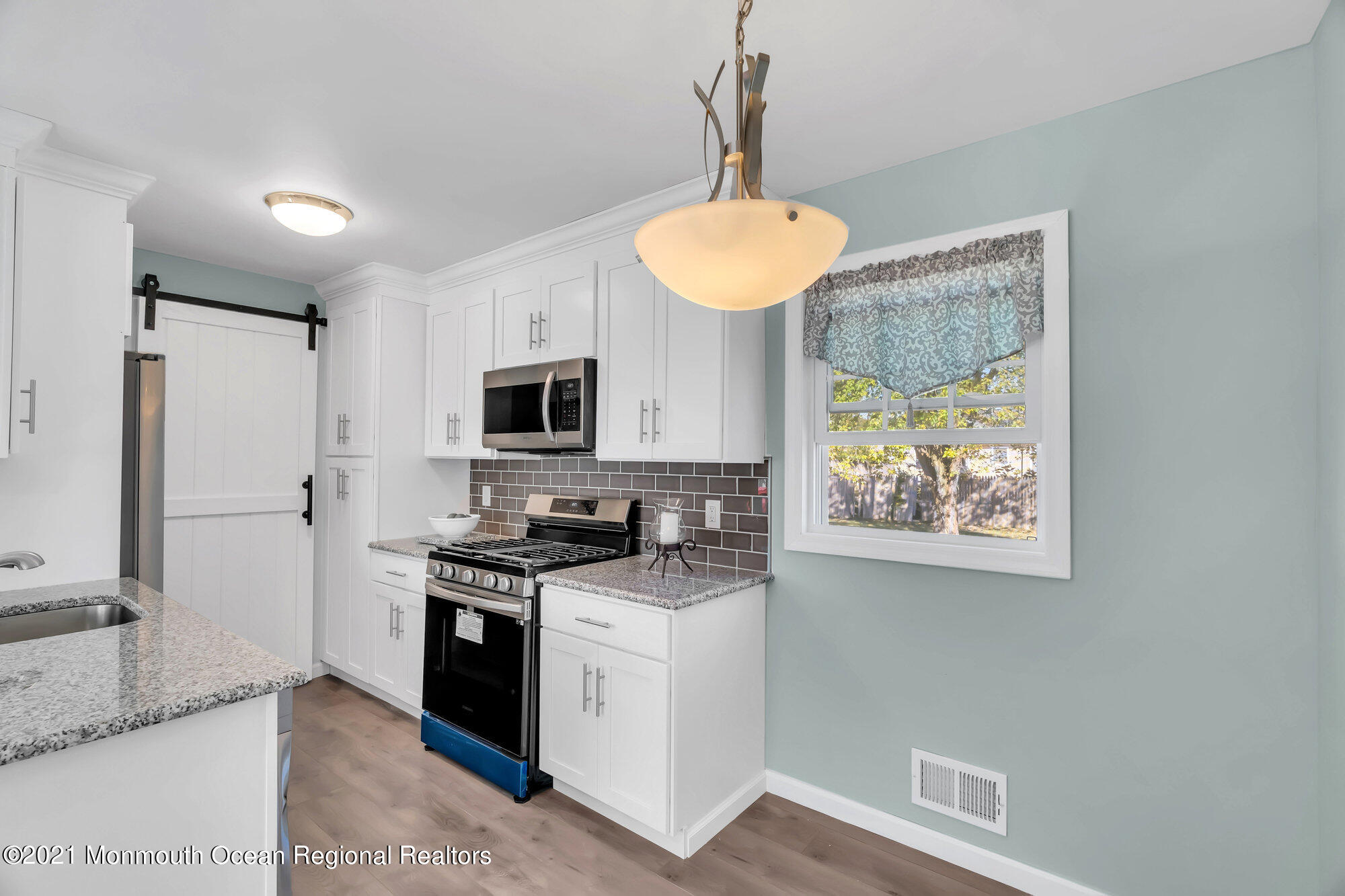318 Bellanca Road Brick, NJ 08723 - Photo 12 of 23 a kitchen with stainless steel appliances granite countertop a stove a sink and a refrigerator