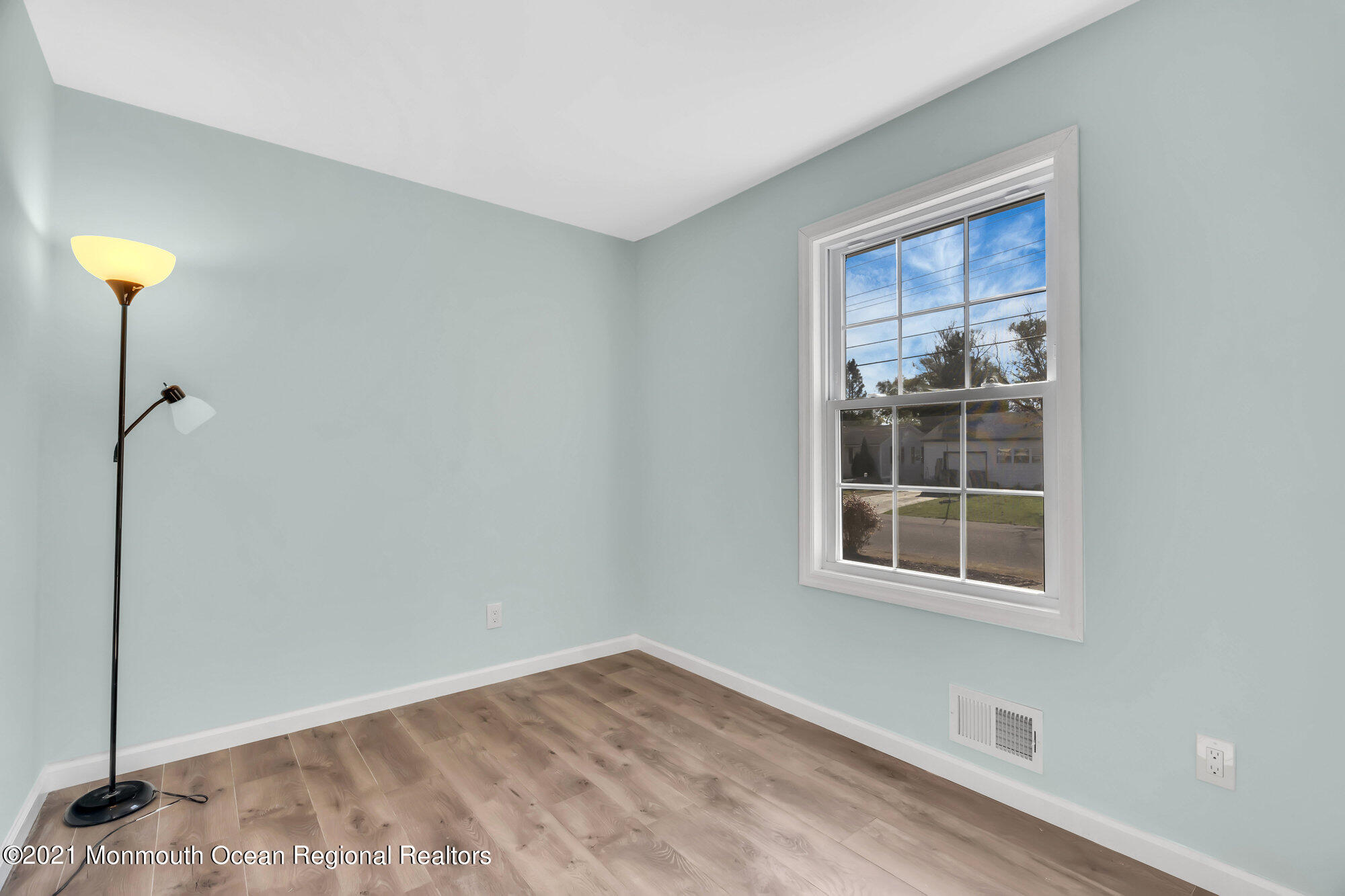 318 Bellanca Road Brick, NJ 08723 - Photo 15 of 23 a view of empty room with wooden floor and fan