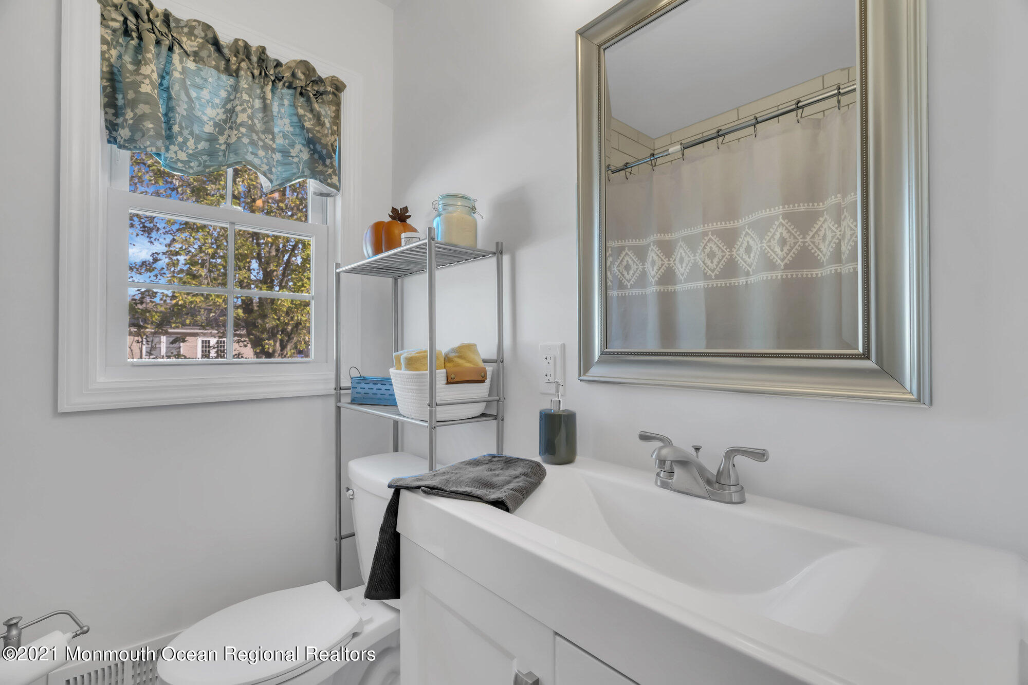 318 Bellanca Road Brick, NJ 08723 - Photo 18 of 23 a bathroom with a sink toilet and vanity