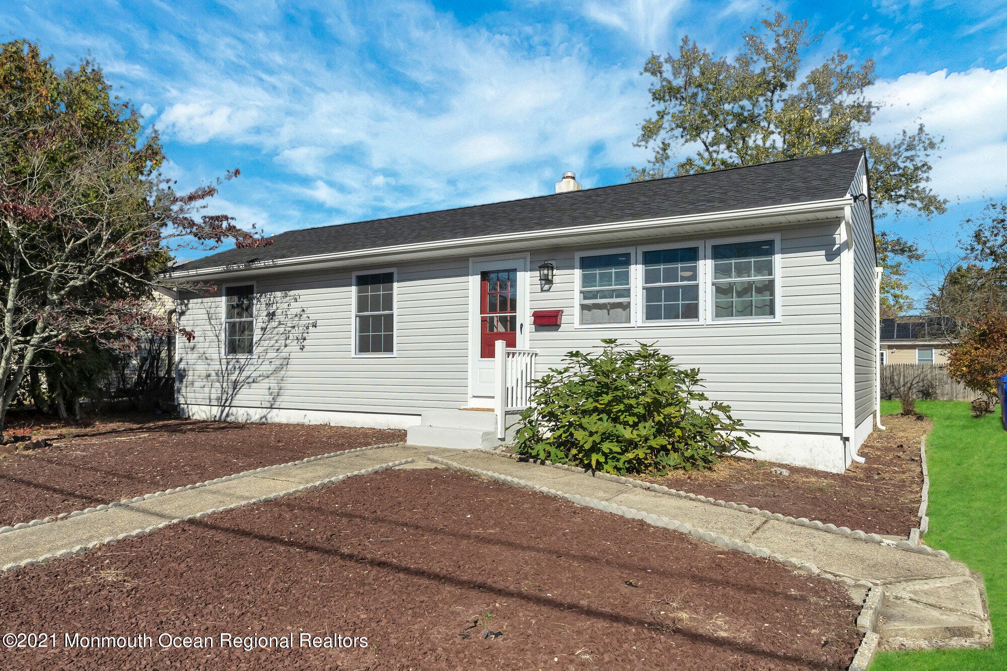 318 Bellanca Road Brick, NJ 08723 - Photo 3 of 23 a front view of a house with a yard and garage