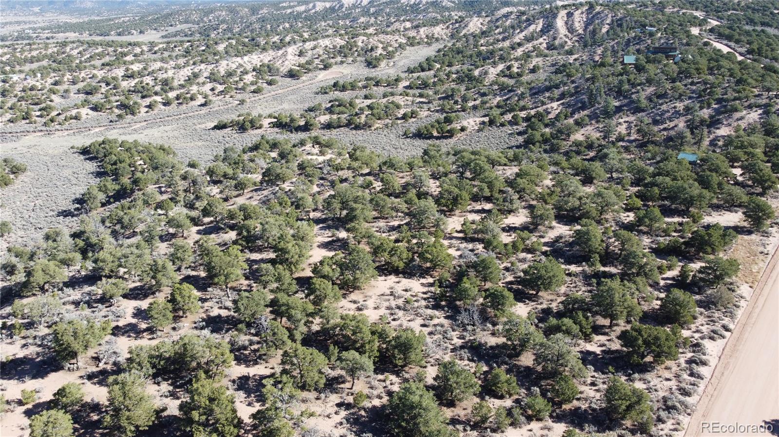 111 Mitchell Road Fort Garland, CO 81133 - Photo 15 of 23 an aerial view of a house with a yard