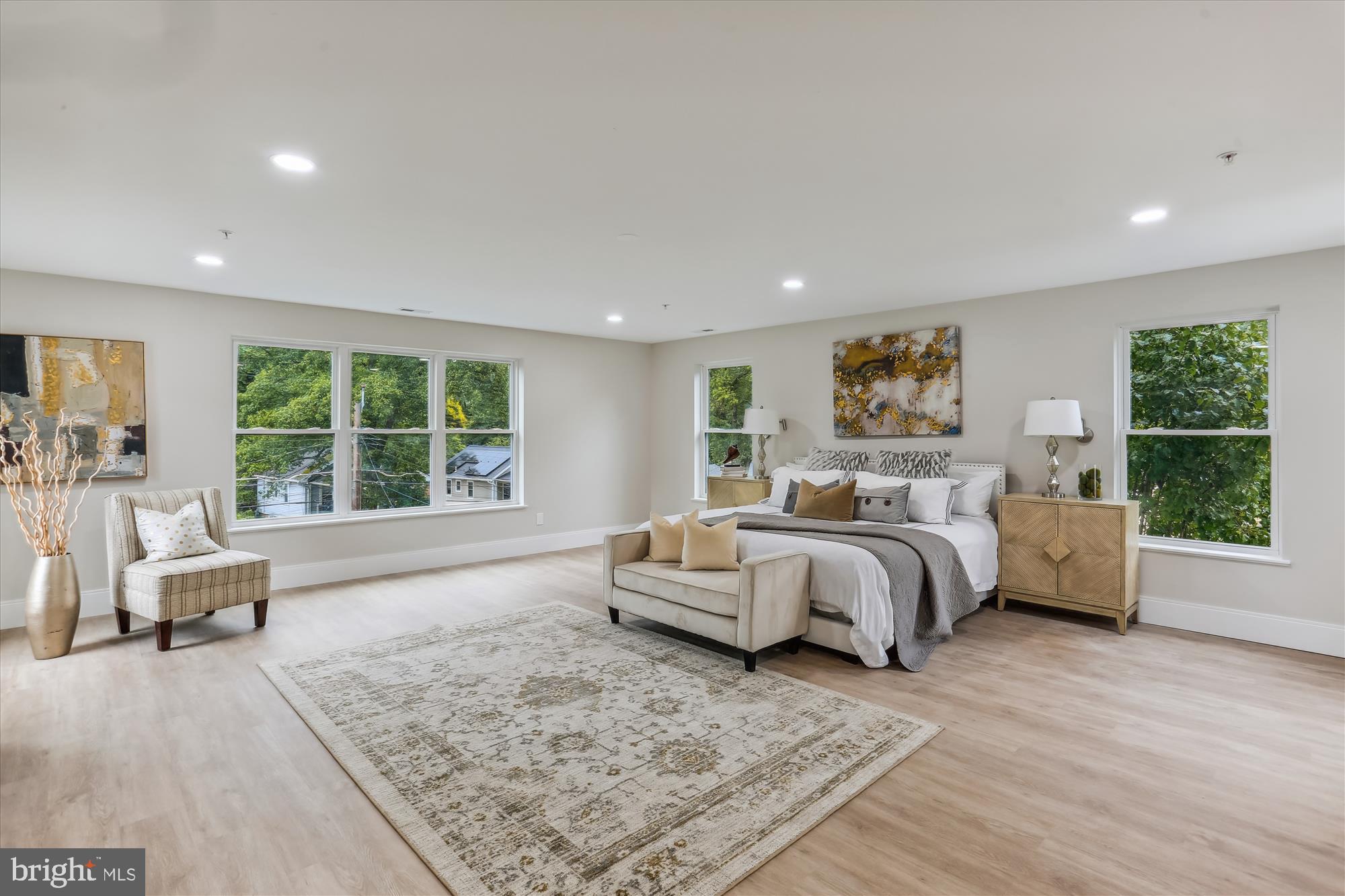 620 Mississippi Avenue Silver Spring, MD 20910 - Photo 25 of 50 a spacious bedroom with a large bed and a couch