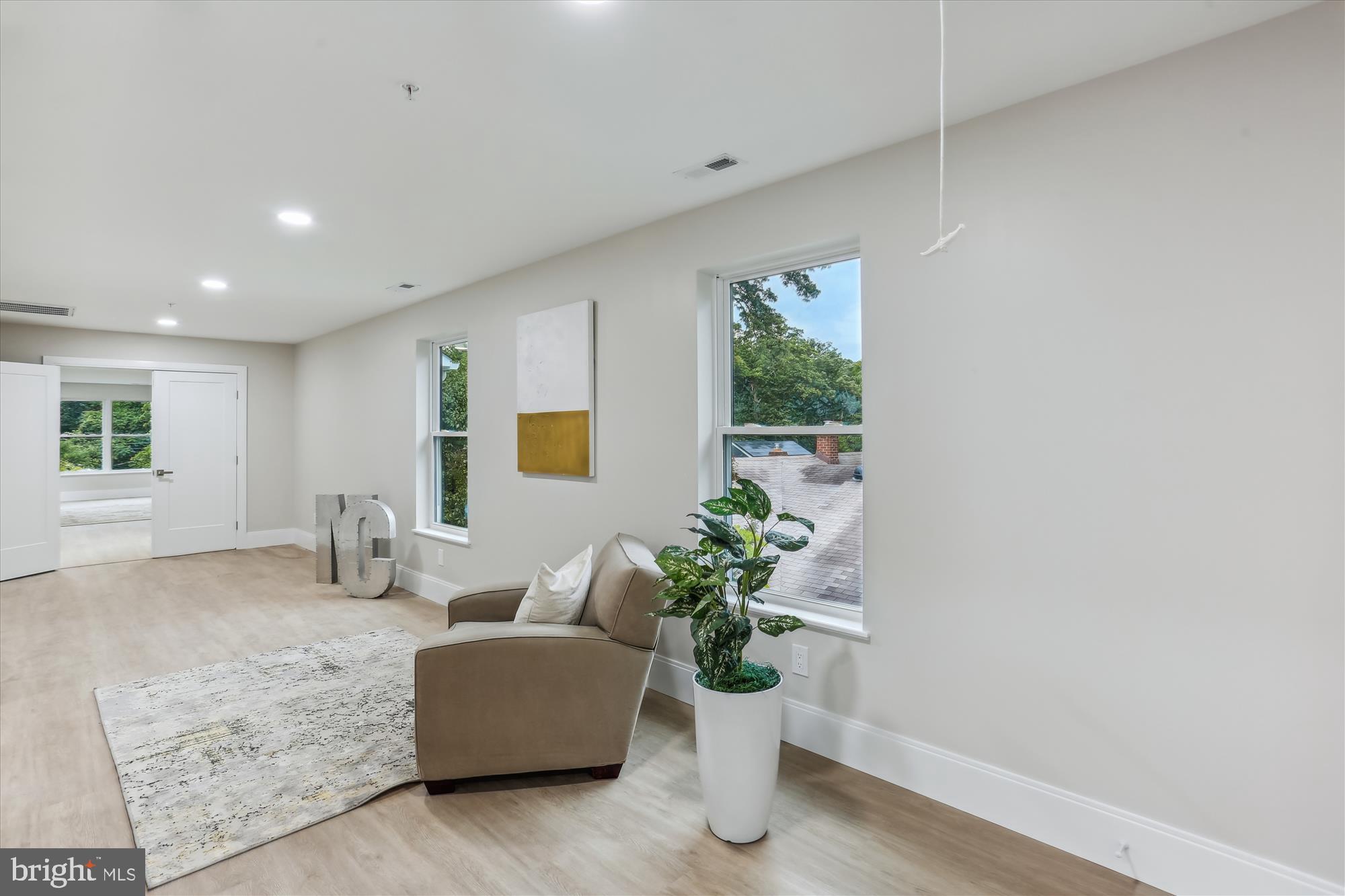 620 Mississippi Avenue Silver Spring, MD 20910 - Photo 32 of 50 a living room with furniture and a potted plant