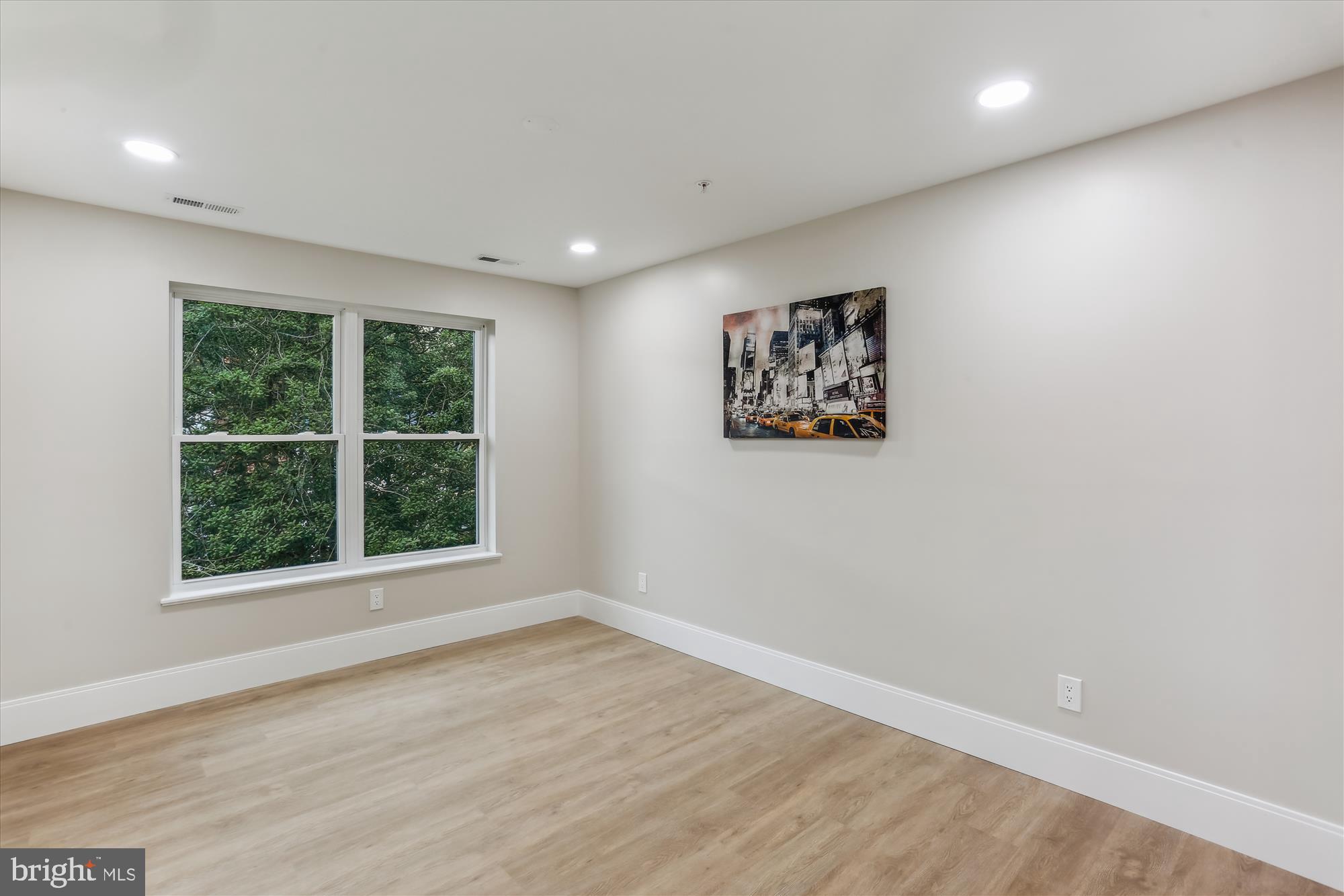 620 Mississippi Avenue Silver Spring, MD 20910 - Photo 34 of 50 an empty room with wooden floor and windows