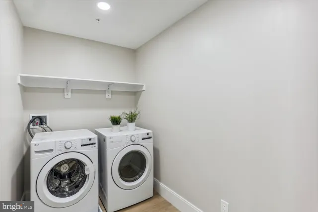 a utility room with dryer and washer