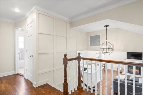 a kitchen with granite countertop white cabinets stainless steel appliances and a sink