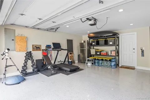 a view of a livingroom with furniture a flat screen tv and outdoor space