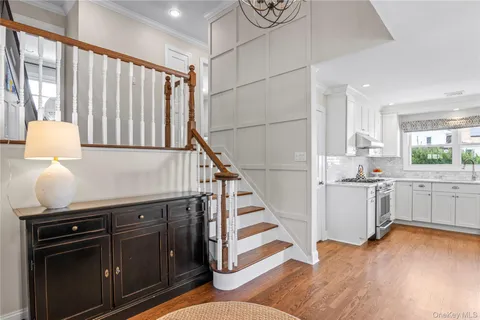 a kitchen with sink cabinets and wooden floor