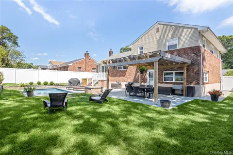 a view of an chairs and table in the patio