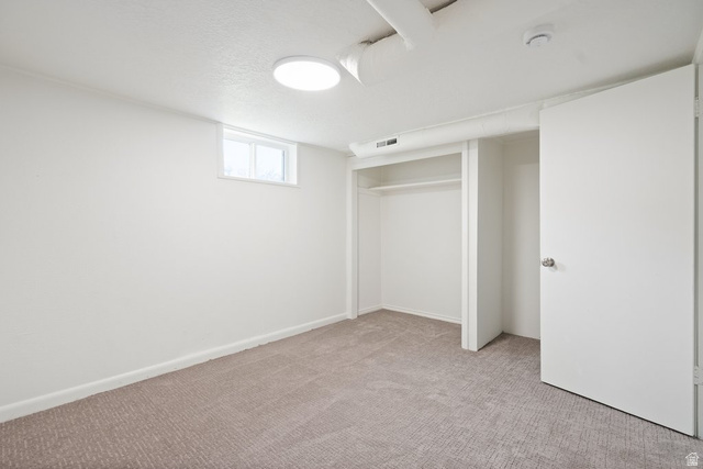 673 East 700 South Springville, UT 84663 - Photo 30 of 43 Carpeted room featuring a neutral color palette, integrated closet space, and a ceiling-mounted light fixture