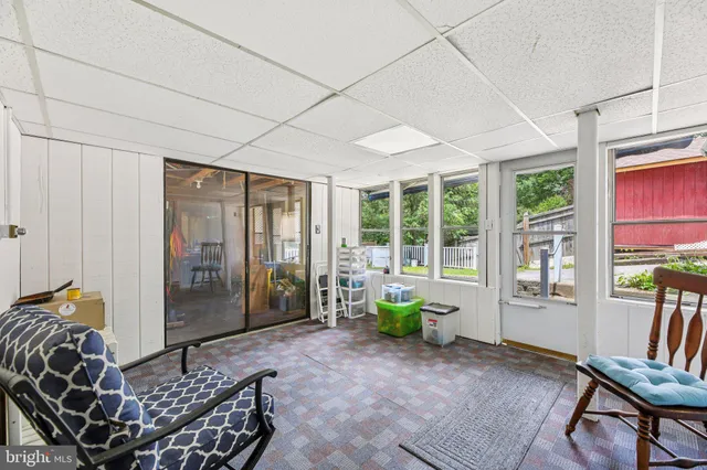a living room with furniture and windows