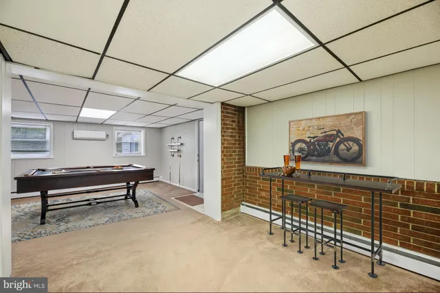 a kitchen with stainless steel appliances granite countertop a sink cabinets and wooden floor