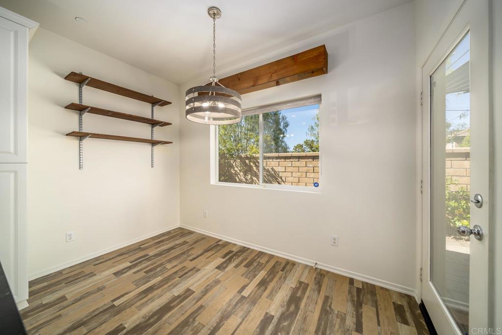 313 Dun Blazer Way Fallbrook, CA 92028 - Photo 11 of 59 a view of empty room with wooden floor and fan