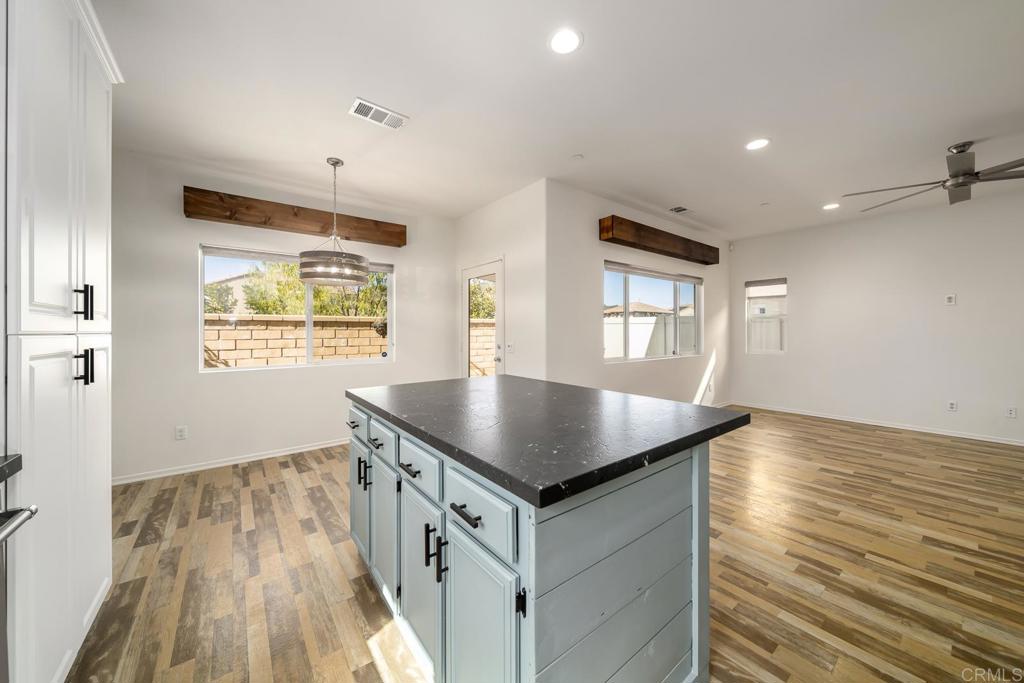 313 Dun Blazer Way Fallbrook, CA 92028 - Photo 14 of 59 a kitchen with stainless steel appliances granite countertop a stove a sink and a refrigerator