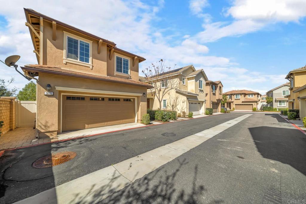 313 Dun Blazer Way Fallbrook, CA 92028 - Photo 2 of 59 a front view of a house with a yard