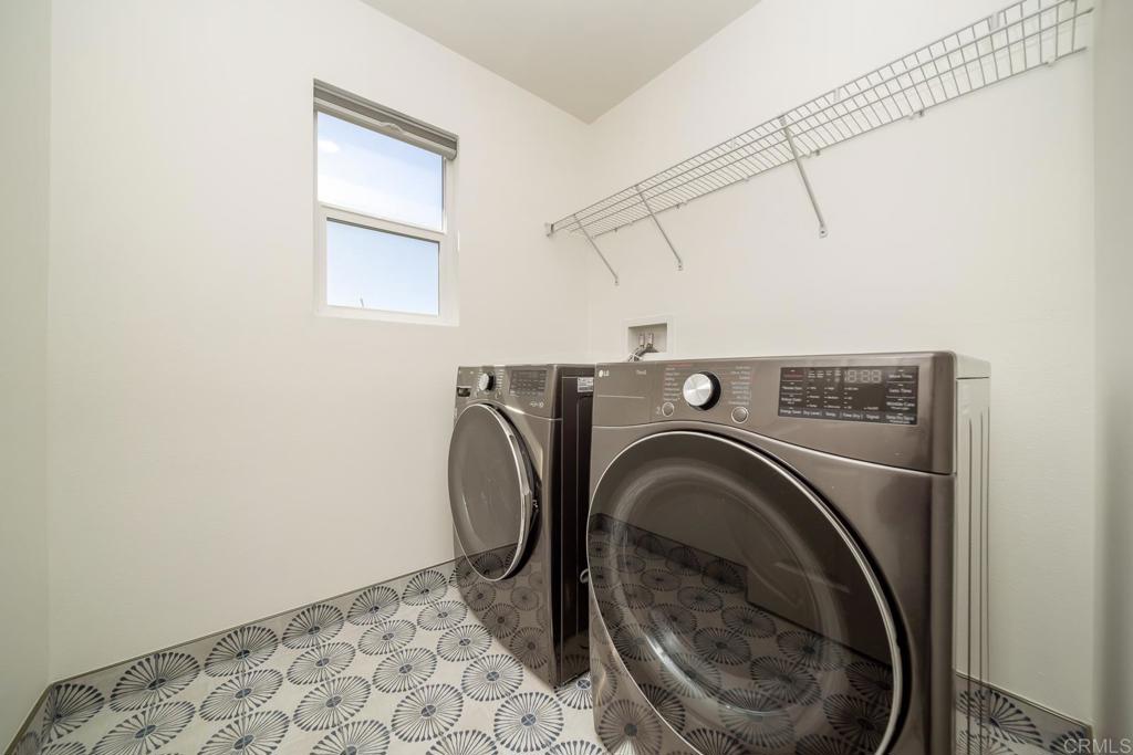 313 Dun Blazer Way Fallbrook, CA 92028 - Photo 32 of 59 a view of a storage & utility room with washer and dryer