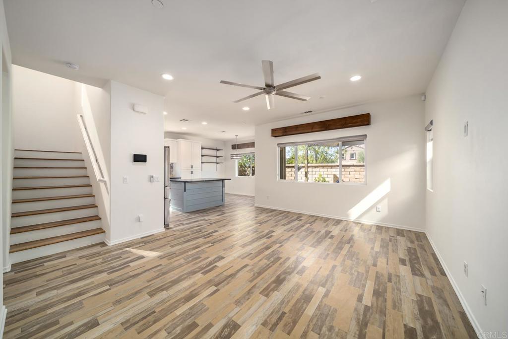 313 Dun Blazer Way Fallbrook, CA 92028 - Photo 4 of 59 wooden floor in an empty room with a window