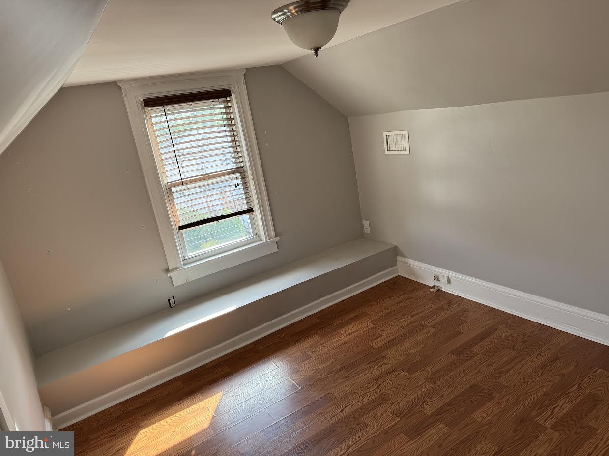 23 Long Avenue, Unit 2 Hillside, NJ 07205 - Photo 12 of 13 a view of an empty room with wooden floor and a window
