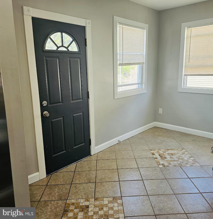23 Long Avenue, Unit 2 Hillside, NJ 07205 - Photo 4 of 13 an empty room with windows and closet