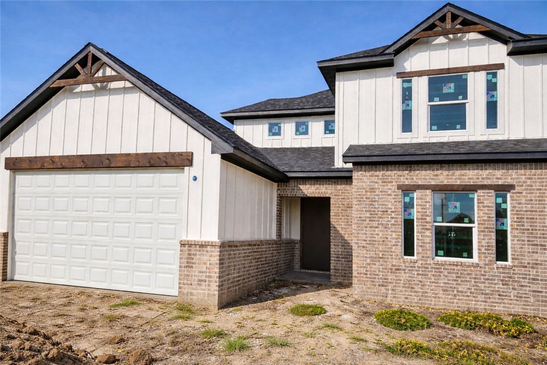 2818 Spector Drive Bryan, TX 77808 - Photo 1 of 8 a front view of a house with a yard