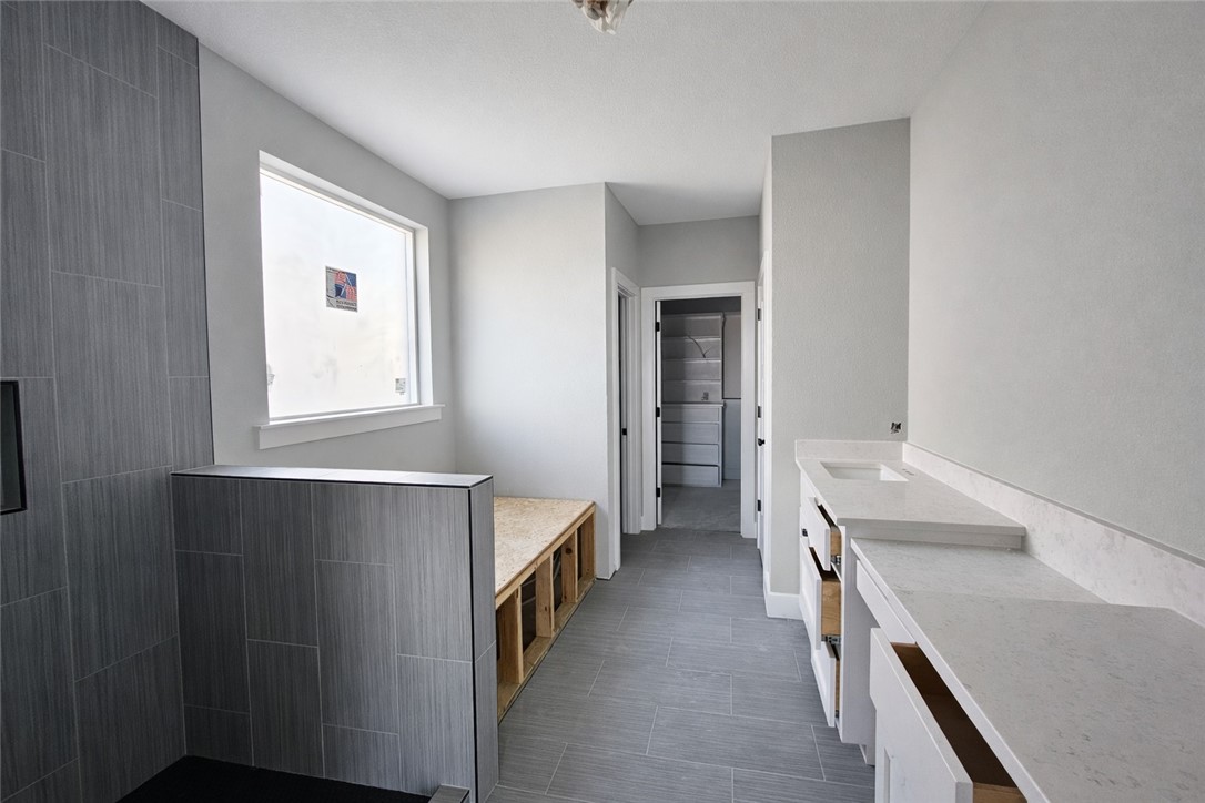 2818 Spector Drive Bryan, TX 77808 - Photo 5 of 8 a room with a bed and a washing machine