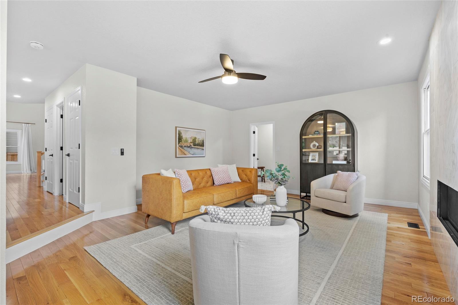 7 Red Maple Place Littleton, CO 80127 - Photo 13 of 50 a living room with furniture and a chandelier