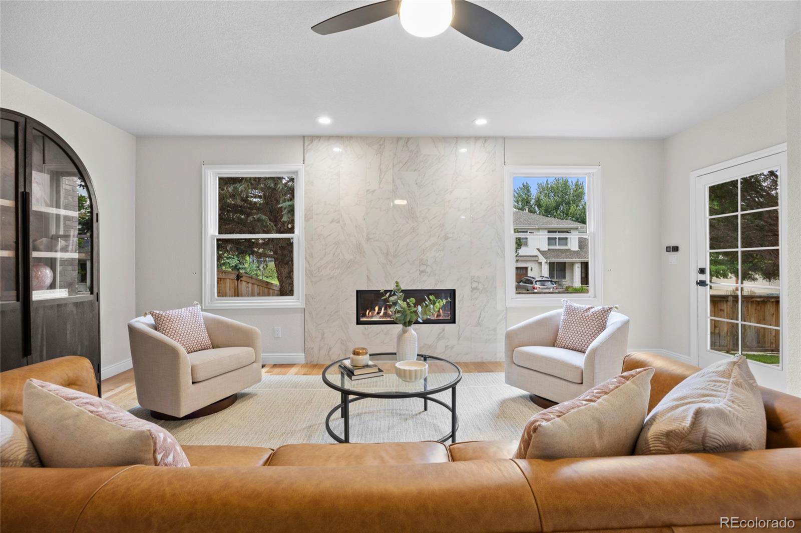 7 Red Maple Place Littleton, CO 80127 - Photo 14 of 50 a living room with furniture and a large window
