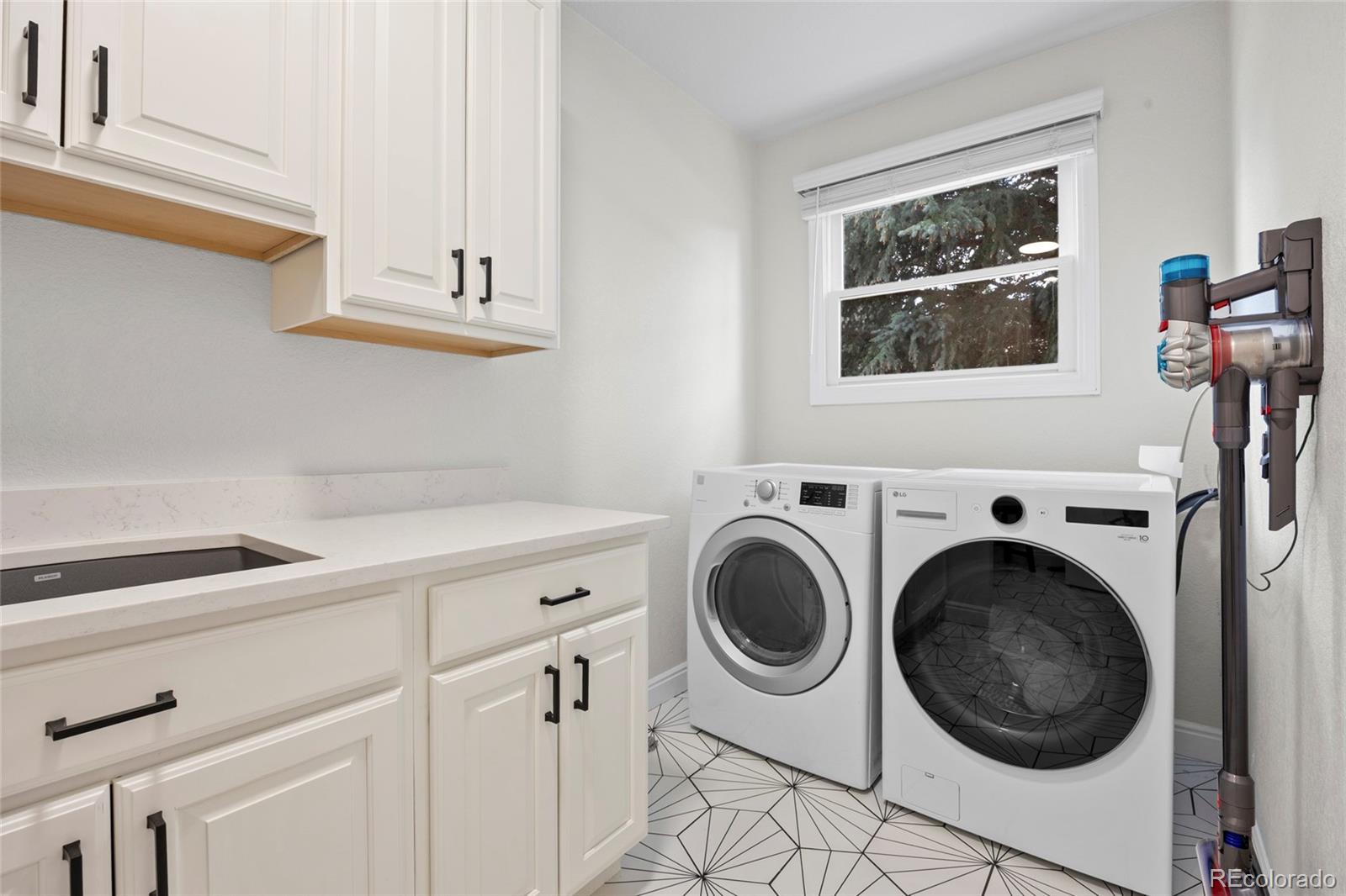7 Red Maple Place Littleton, CO 80127 - Photo 16 of 50 a utility room with dryer and washer