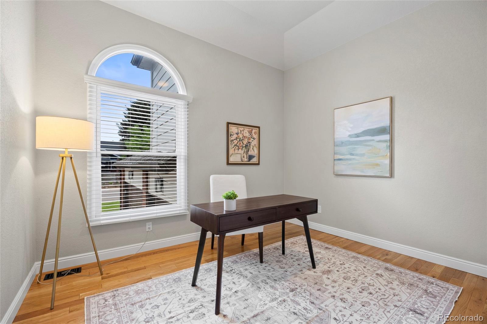 7 Red Maple Place Littleton, CO 80127 - Photo 17 of 50 a view of a workspace with furniture and a window