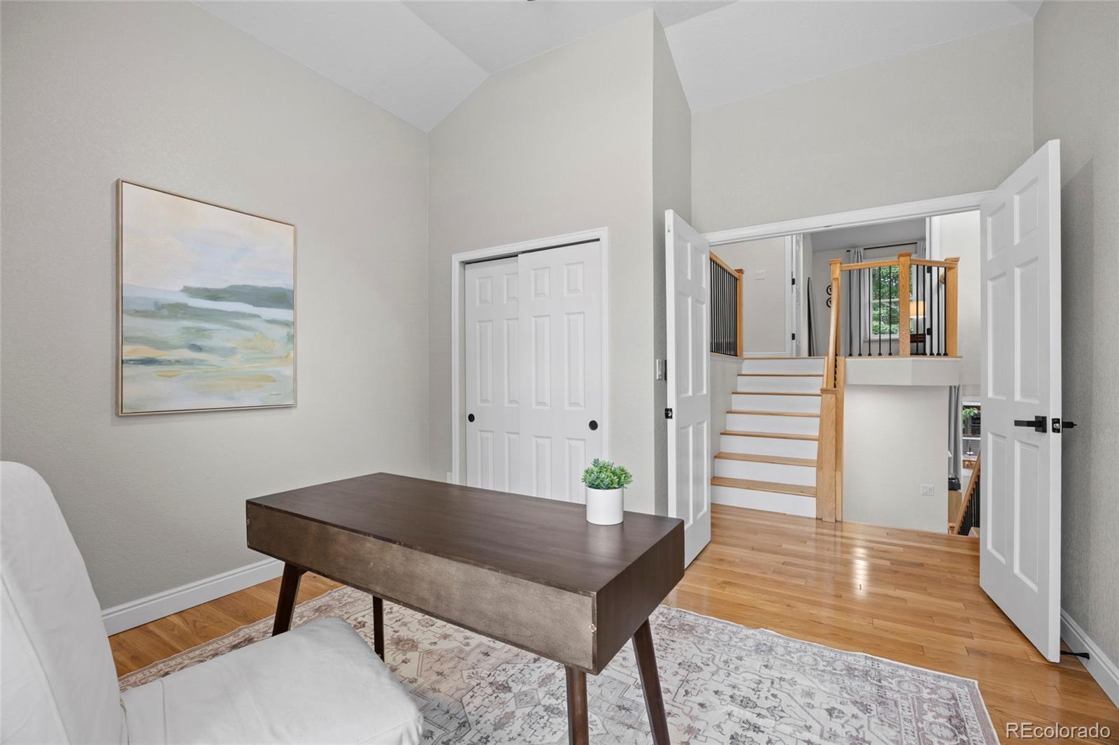 7 Red Maple Place Littleton, CO 80127 - Photo 18 of 50 a view of a livingroom with furniture and wooden floor
