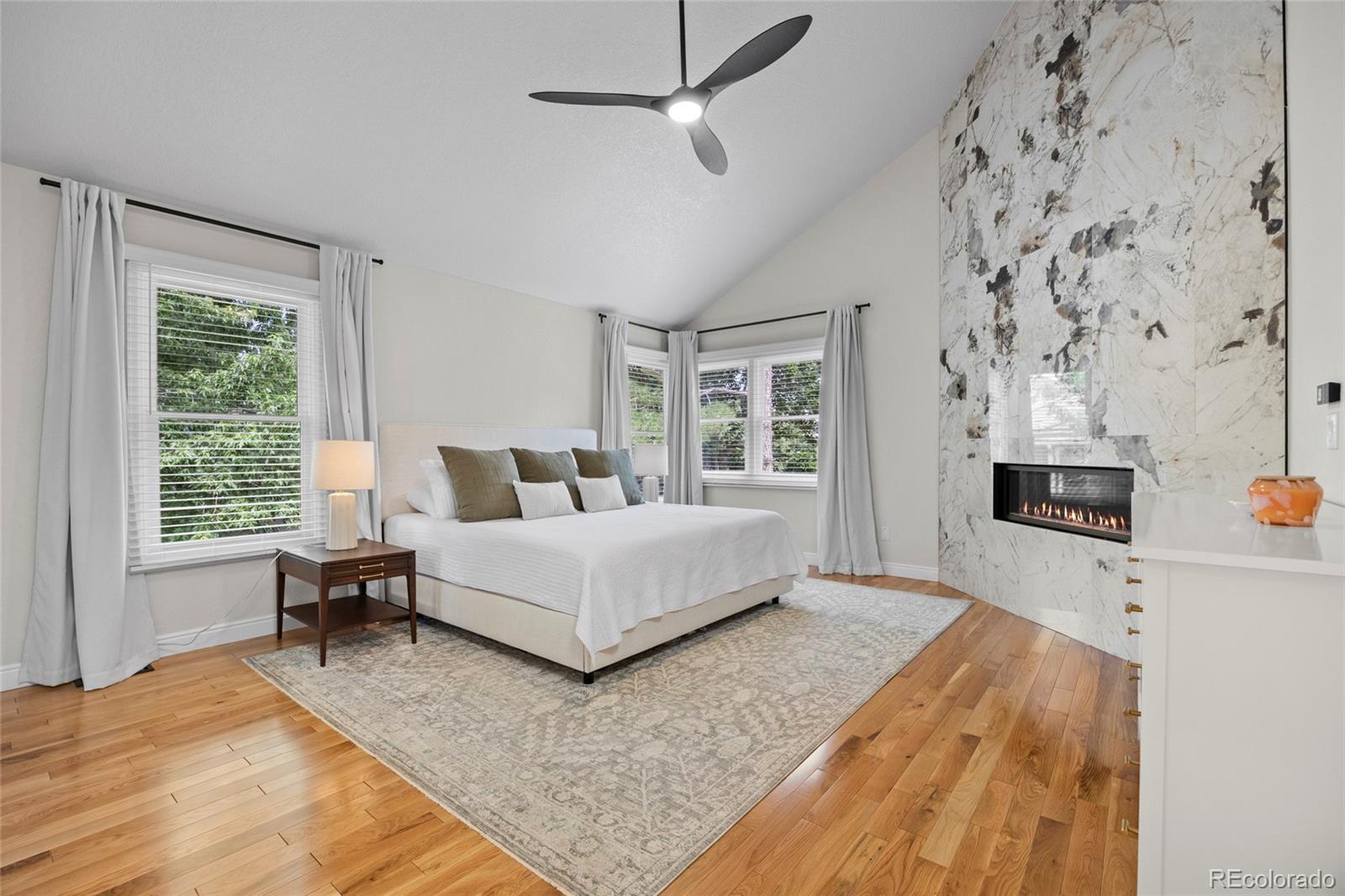 7 Red Maple Place Littleton, CO 80127 - Photo 19 of 50 a living room with furniture and a fireplace
