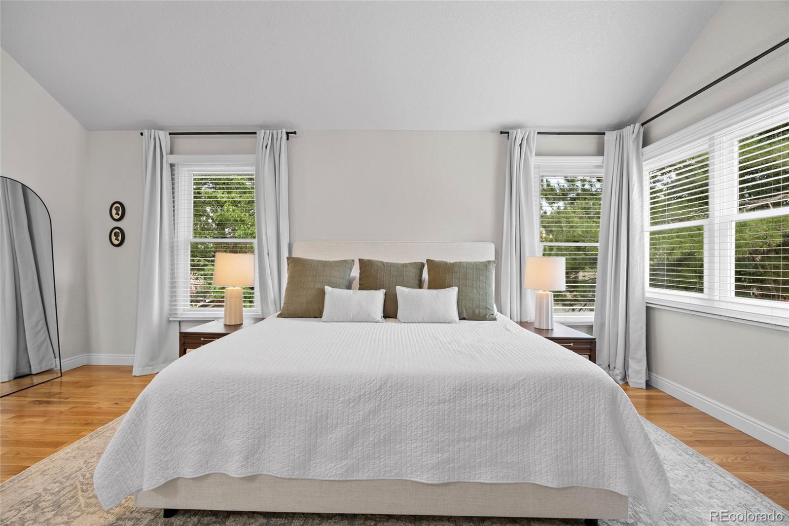 7 Red Maple Place Littleton, CO 80127 - Photo 20 of 50 a bedroom with a large bed and a large window