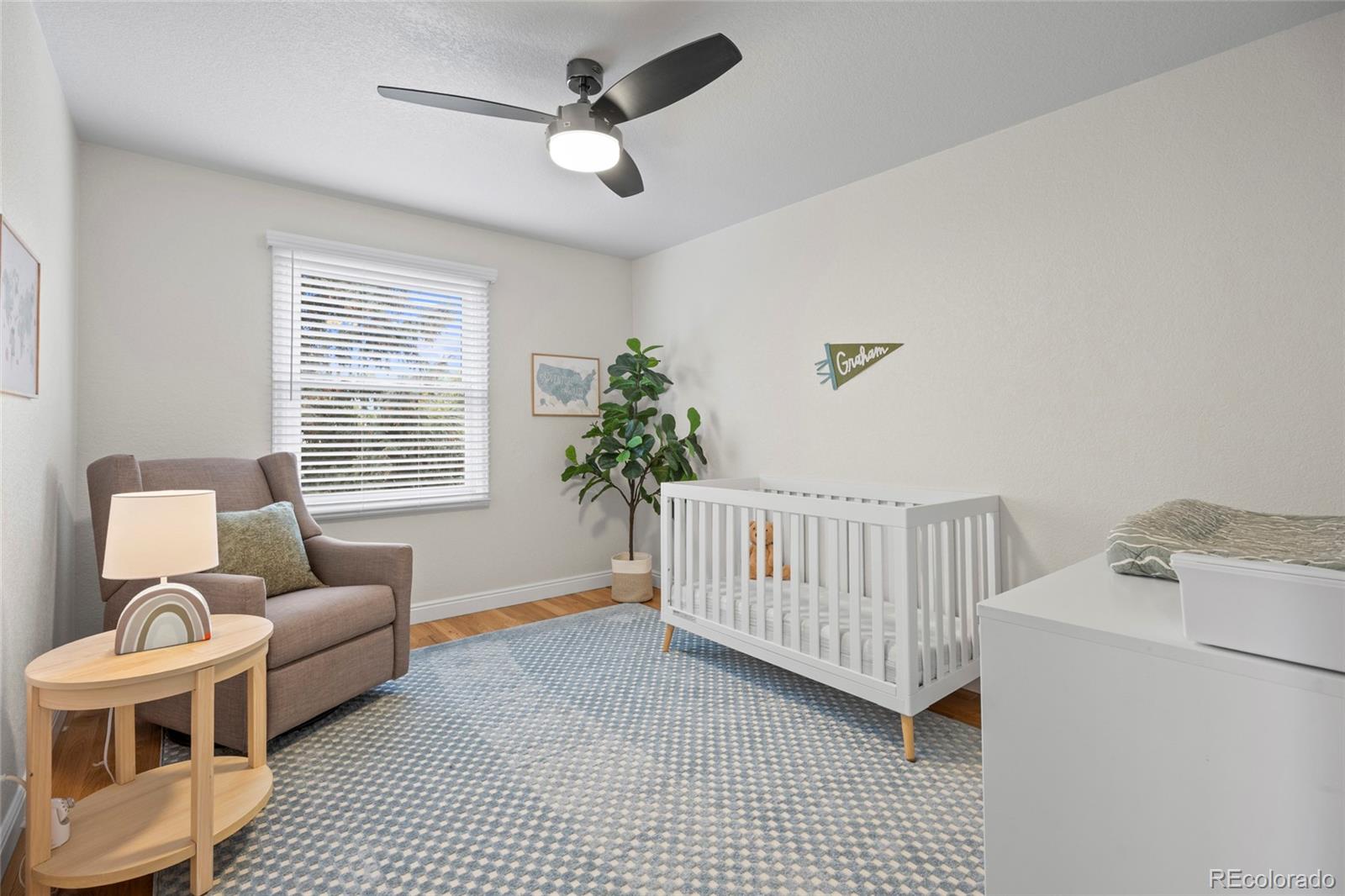 7 Red Maple Place Littleton, CO 80127 - Photo 27 of 50 a living room with furniture and a window