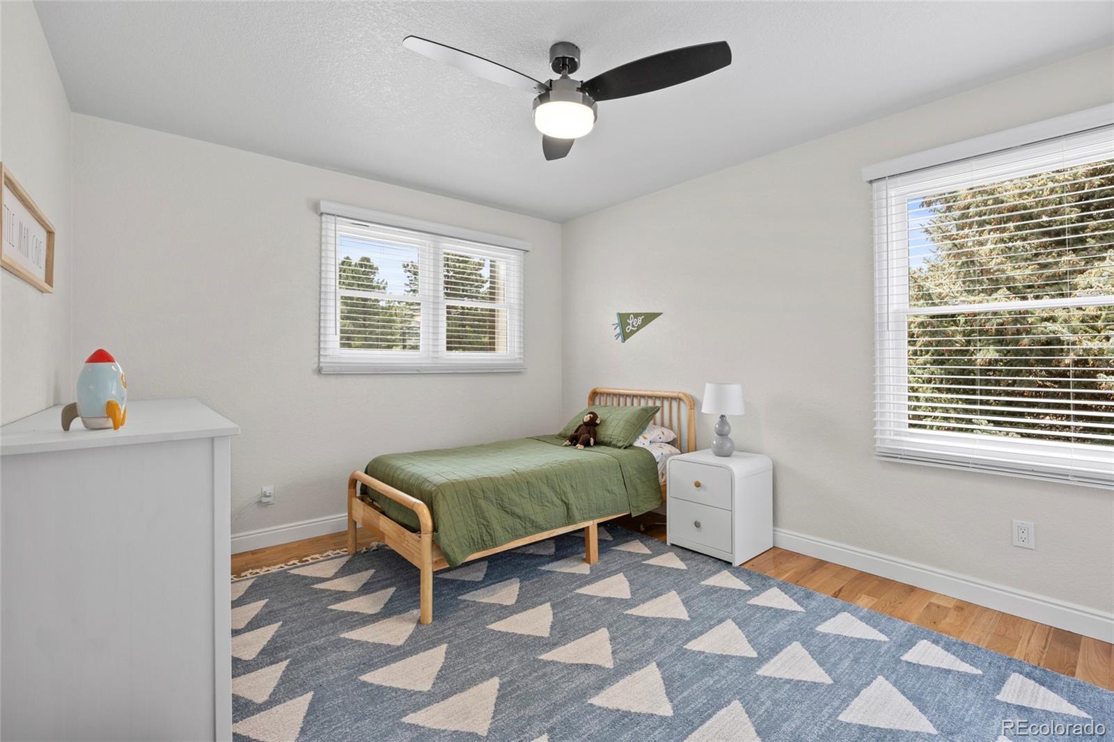 7 Red Maple Place Littleton, CO 80127 - Photo 29 of 50 a bedroom with 2 bed and a window