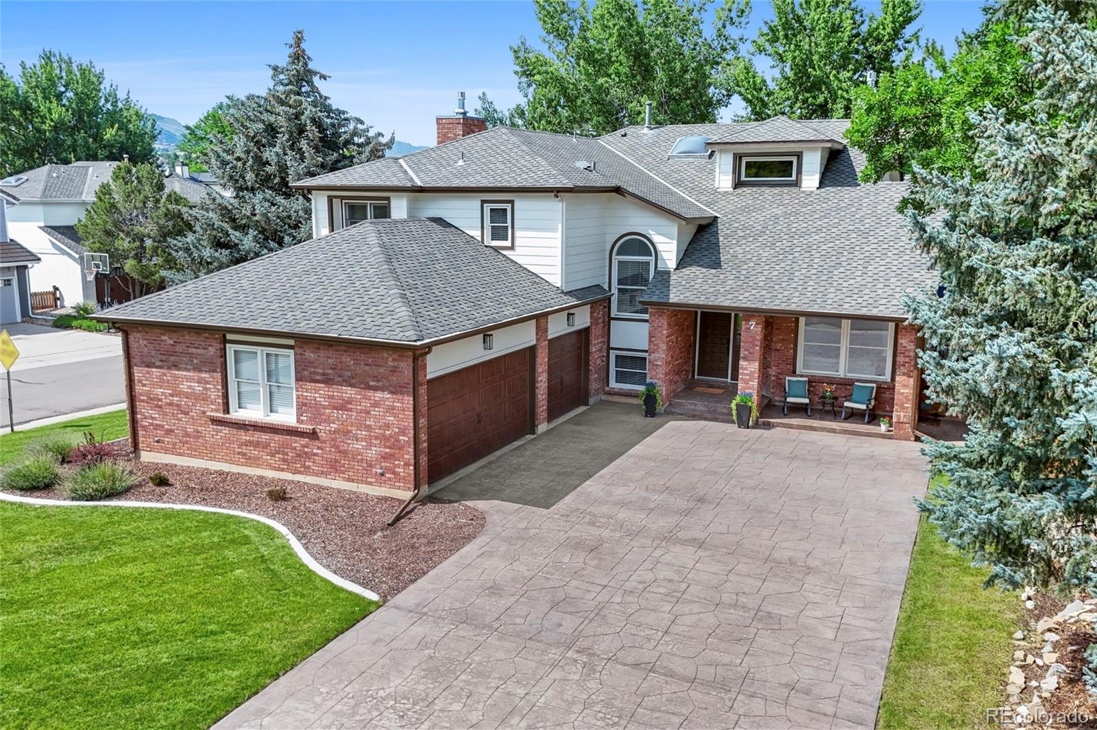 7 Red Maple Place Littleton, CO 80127 - Photo 40 of 50 a aerial view of a house with a yard and plants