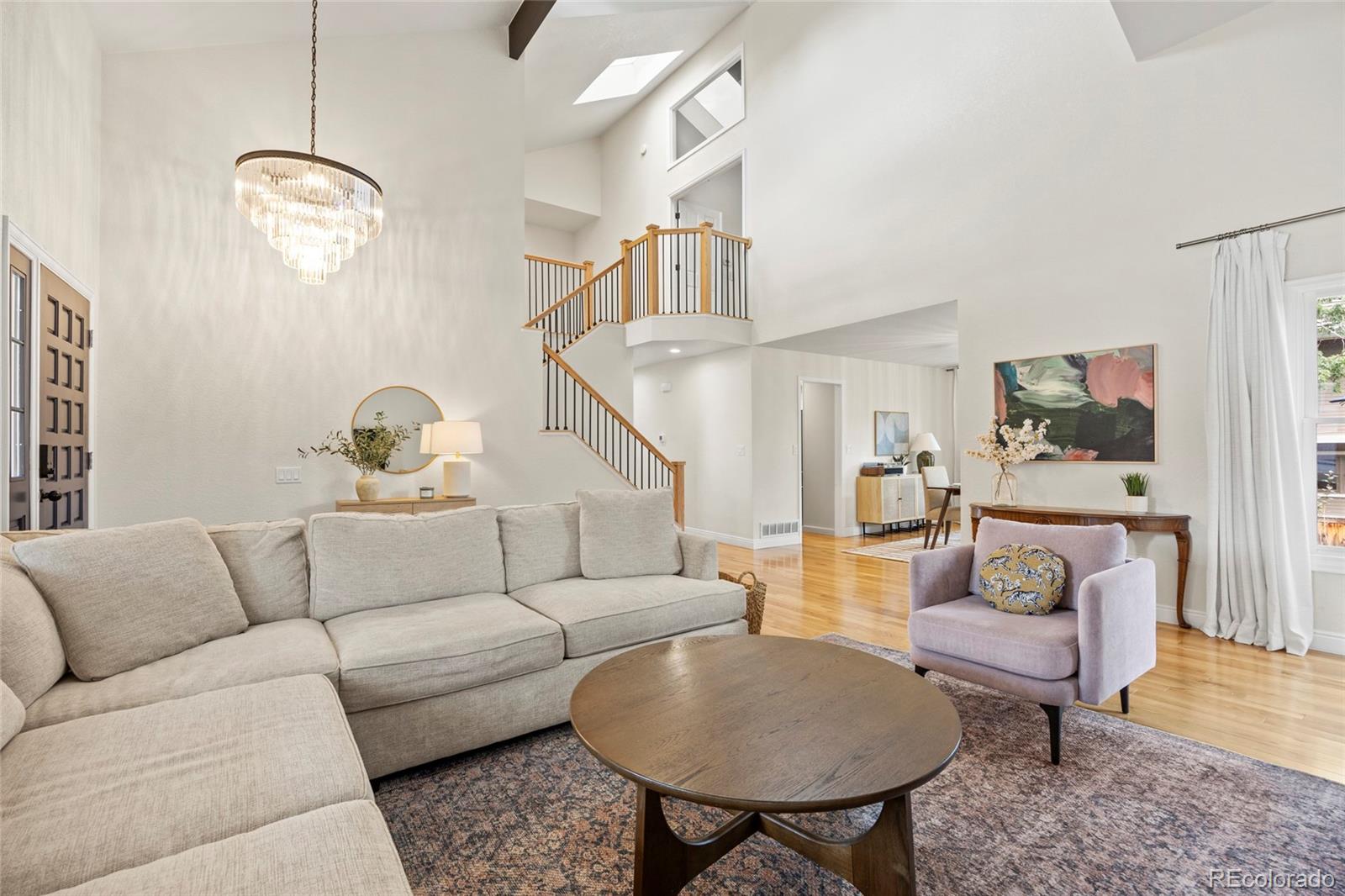 7 Red Maple Place Littleton, CO 80127 - Photo 4 of 50 a living room with furniture and wooden floor