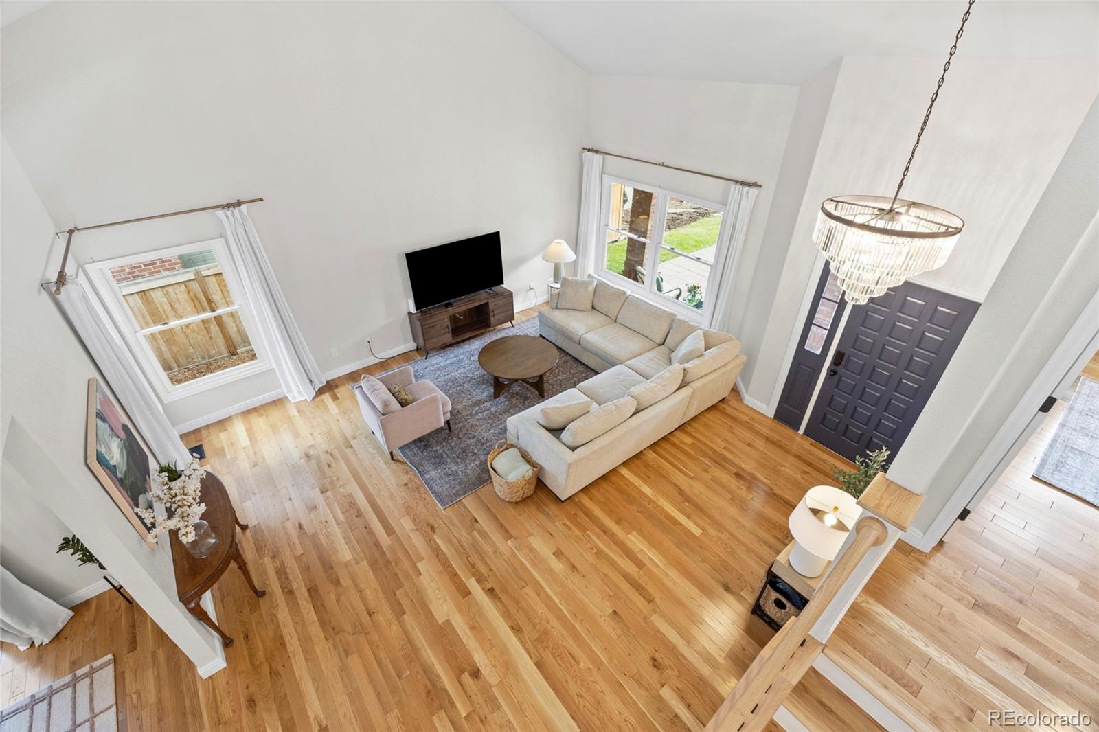 7 Red Maple Place Littleton, CO 80127 - Photo 5 of 50 a living room with furniture and a flat screen tv
