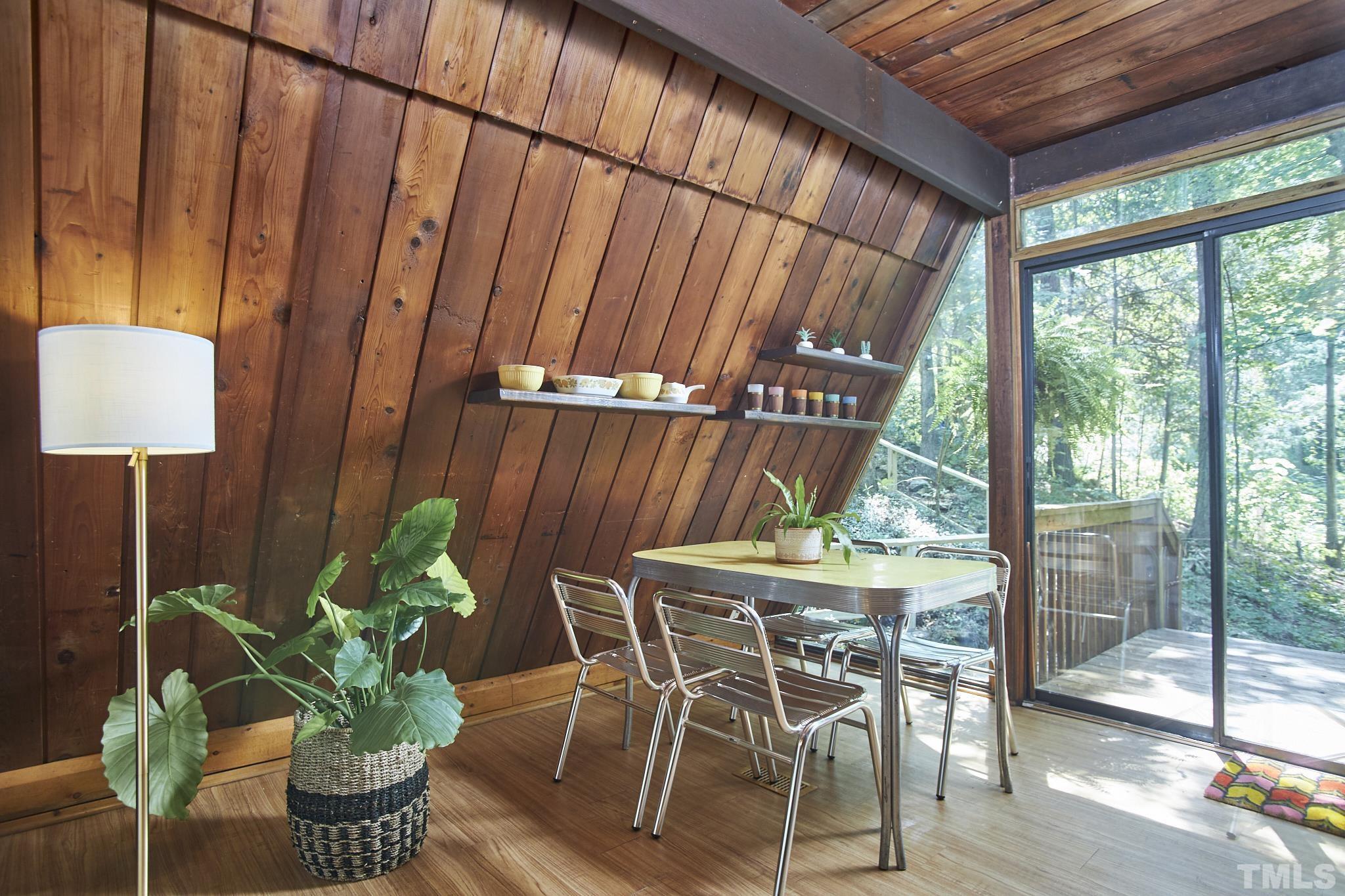 1002 Wave Road Chapel Hill, NC 27517 - Photo 16 of 43 a dining room with furniture and wooden floor