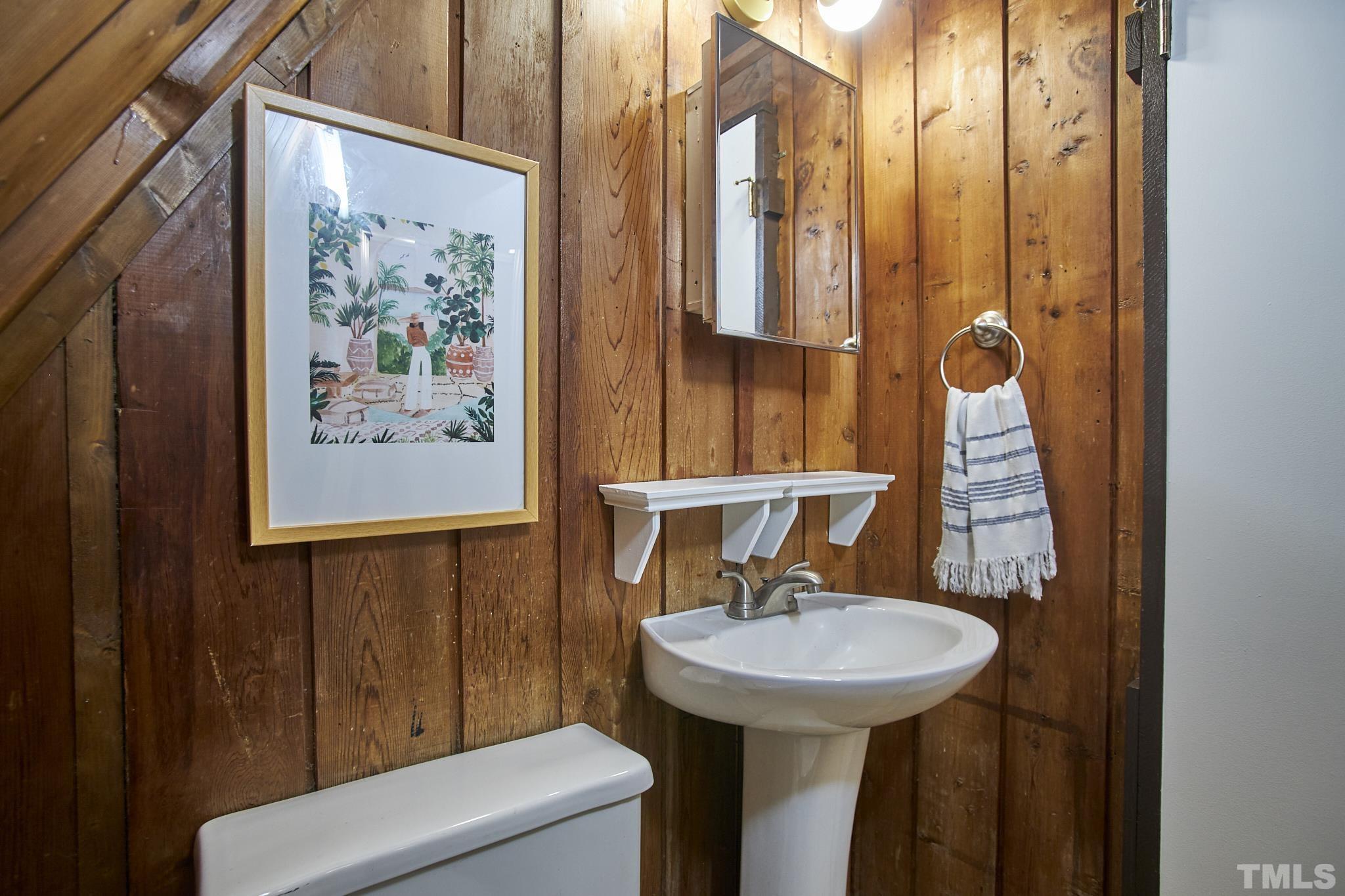 1002 Wave Road Chapel Hill, NC 27517 - Photo 24 of 43 a bathroom with a sink a toilet and shower curtain