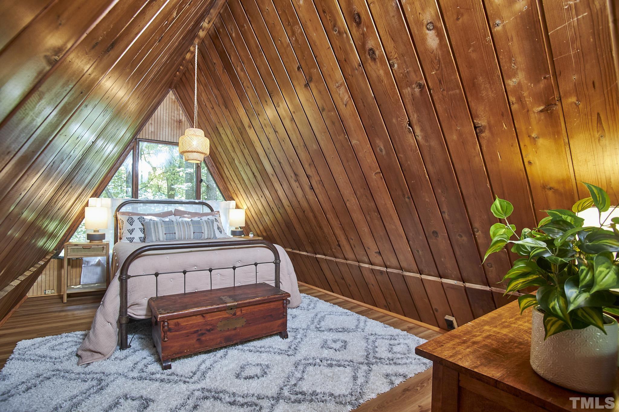 1002 Wave Road Chapel Hill, NC 27517 - Photo 32 of 43 a bed sitting in a bedroom next to a window