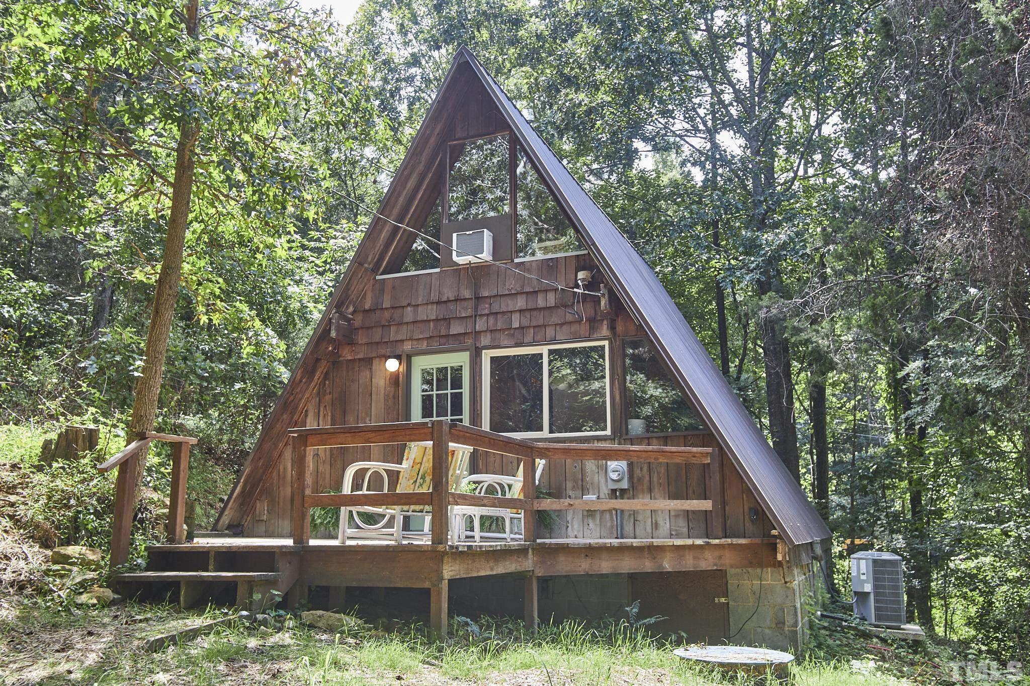 1002 Wave Road Chapel Hill, NC 27517 - Photo 37 of 43 a view of a house with large windows and a small yard