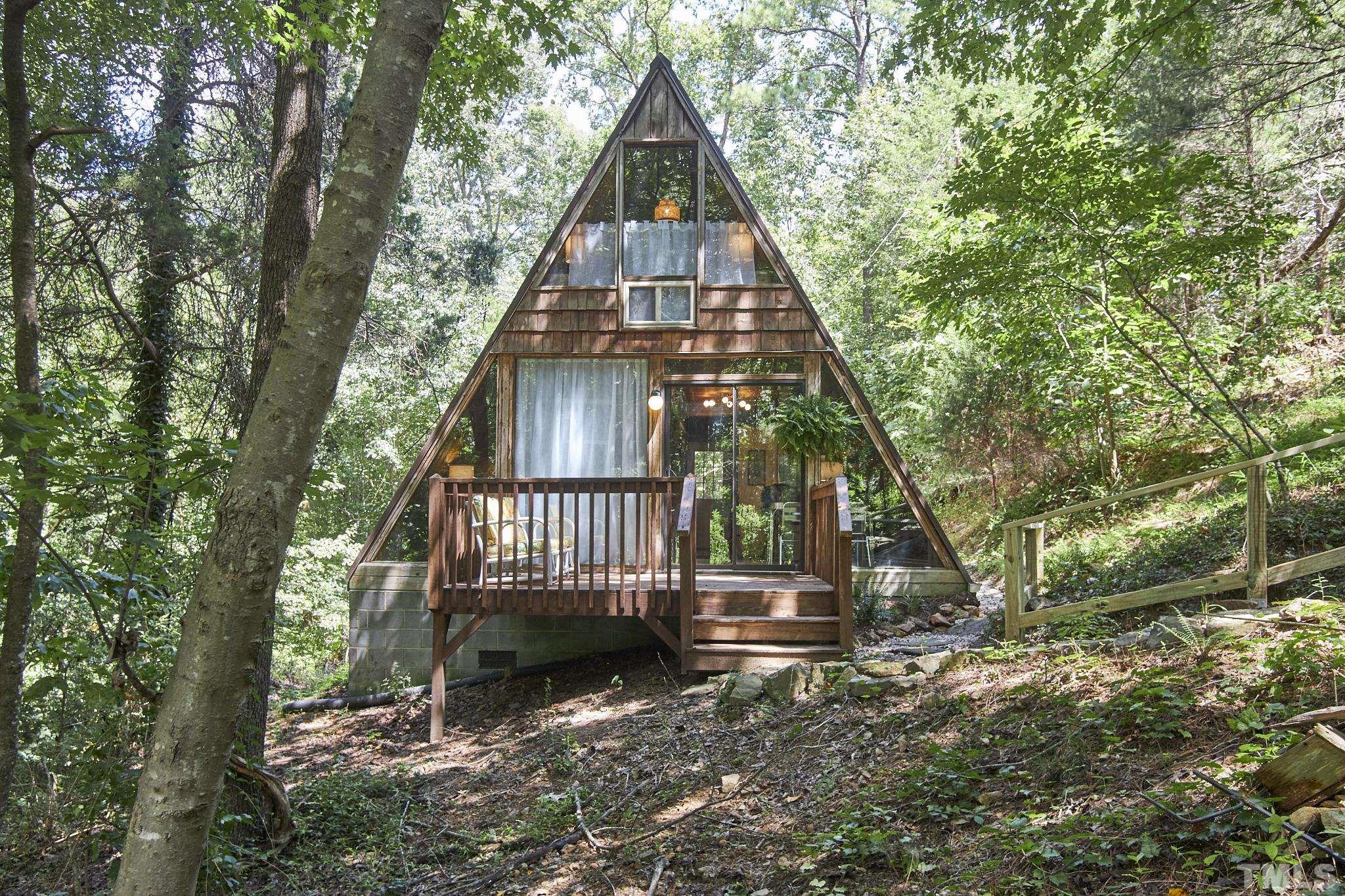 1002 Wave Road Chapel Hill, NC 27517 - Photo 4 of 43 a view of a house with a yard