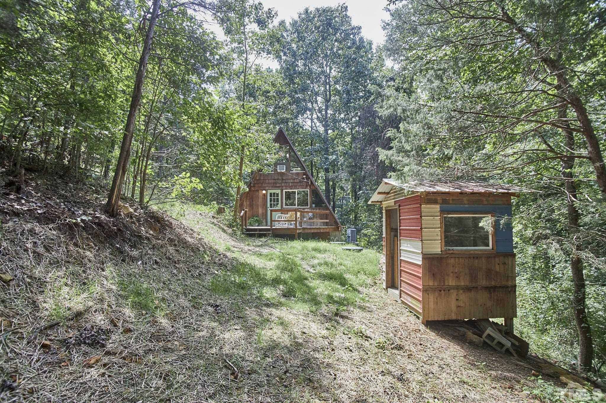 1002 Wave Road Chapel Hill, NC 27517 - Photo 42 of 43 a front view of a house with a garden