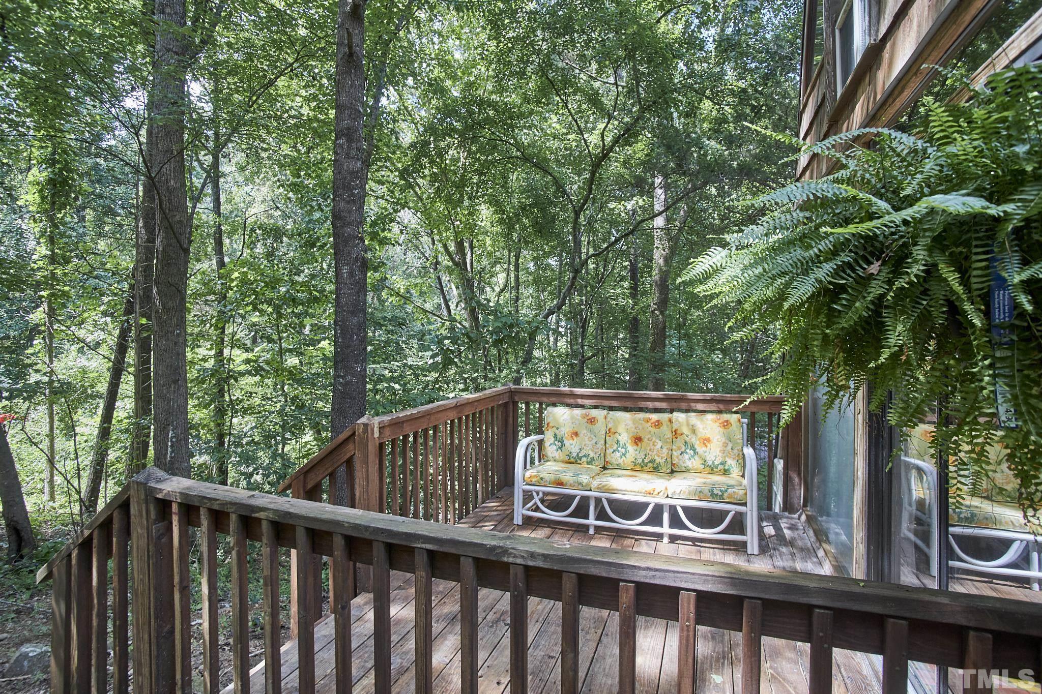 1002 Wave Road Chapel Hill, NC 27517 - Photo 6 of 43 a view of outdoor space with deck and trees